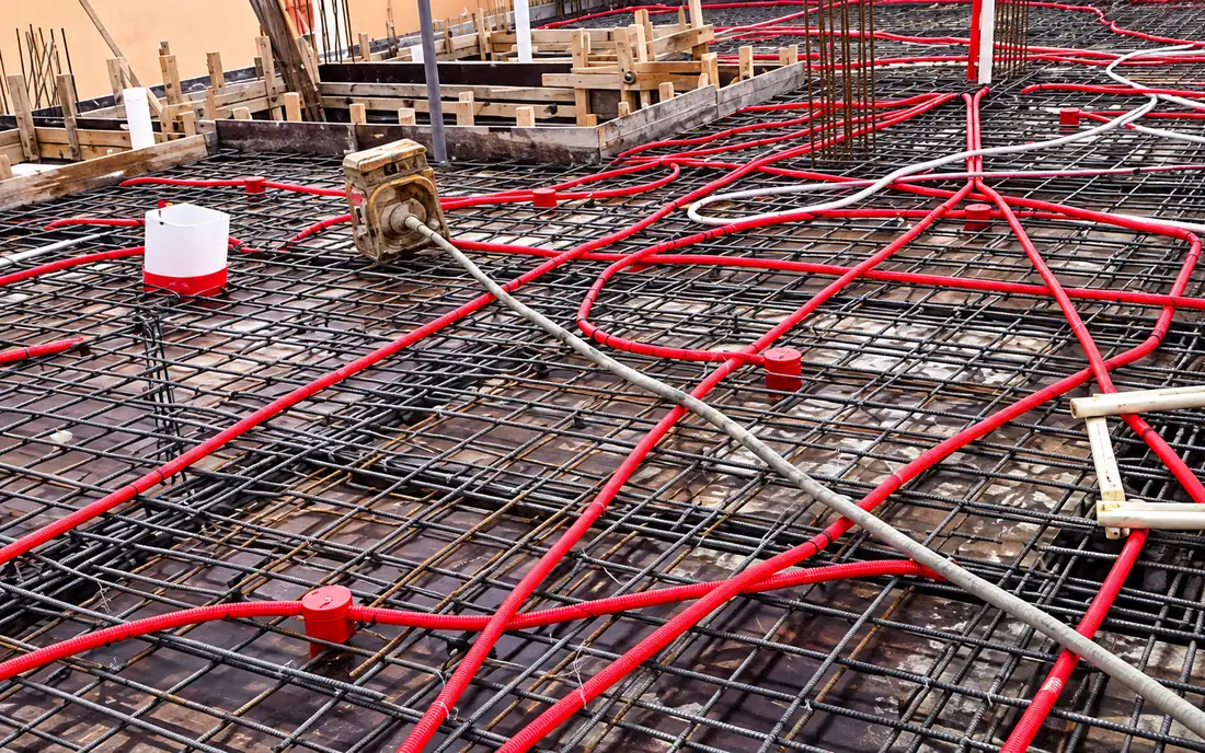 Electrical conduit runs laid over the reinforcement before the pour